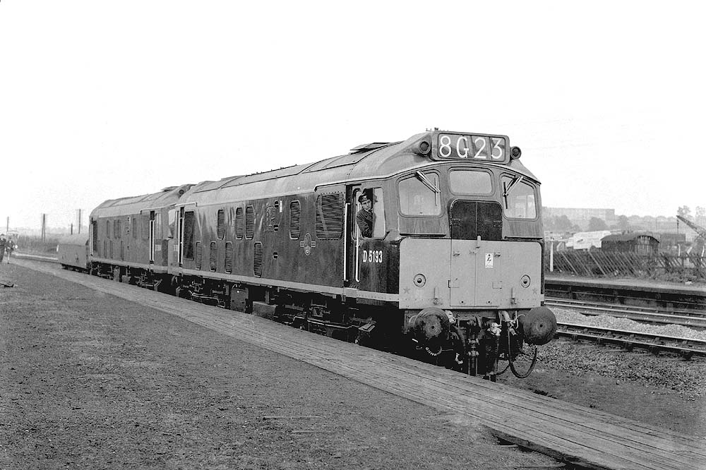 View of British Railways Type 2 D5193 locomotive coupled with an unknown classmate standing at Bromford Bridge station's up platform