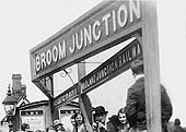 Close up showing the station's name board with a separate reference to the Stratford Midland Junction Railway