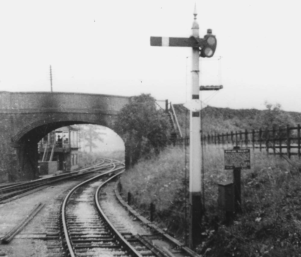 Looking towards Evesham, with Broom Junction Signal Box and the junction, visible through the bridge