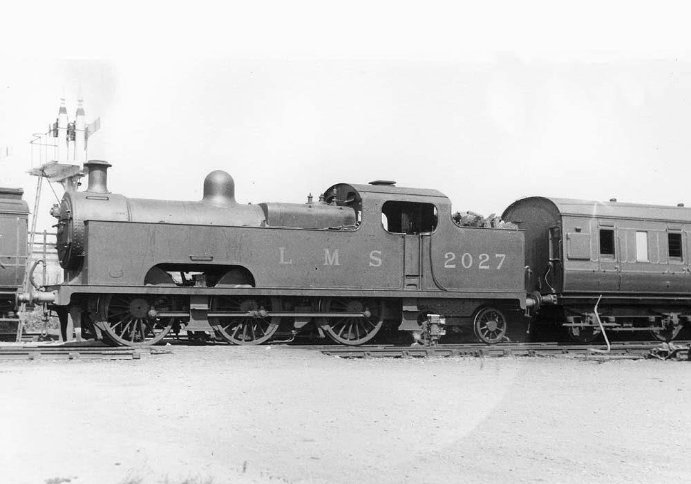 Ex-MR 0-6-4T 'Flatiron' No 2027 is seen at the head of a Birmingham New Street to Ashchurch train in 1933