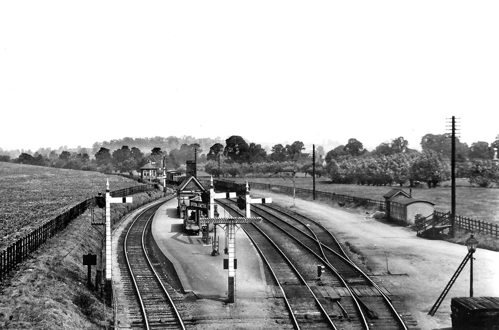 A panoramic view of Broom Junction station looking towards Redditch on a quiet day with no passengers visible