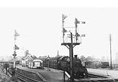 Ex-LMS 3MT 2-6-2T No 171 stands at Broom Junction station with a Birmingham to Ashchurch local service