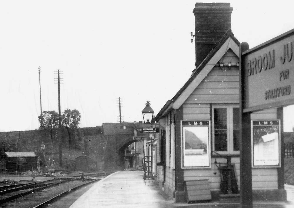Close up showing the Redditch end of the station building with a weighing machine standing under the window