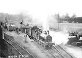 MR 2F 0-6-0 No 3460 with tender piled high blows steam off as it departs Broom Junction station