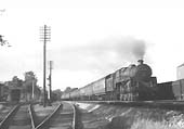 British Railways 5MT 4-6-0 No 73001 heads a southbound express past Cadbury's sidings on Sunday 12th September 1954