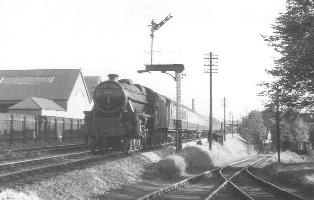 Ex-LMS 4-6-0 No 44878 heads a Birmingham bound train past Cadbury's sidings on Sunday 12th September 1954