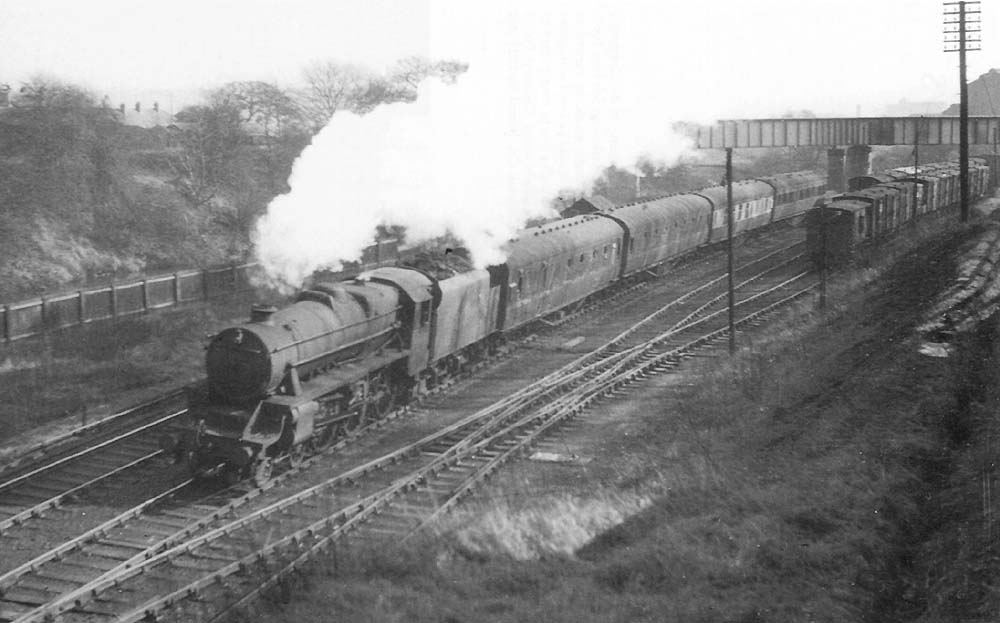 Ex-LMS 4-6-0 'Black 5' No 45273 passes Cadbury exchange siding's on an up train to New Street station