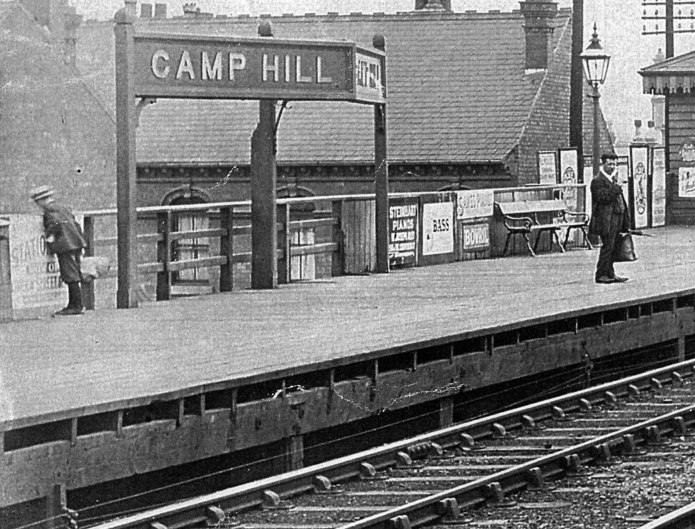 Close up showing a typical Midland Railway twin-faced oblique angled 'running in' or station name board