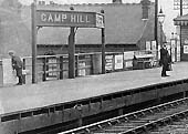 Close up showing a typical Midland Railway twin-faced oblique angled 'running in' or station name board