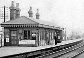 Close up showing the timber framed and clad passenger building located on Camp Hill station's down platform