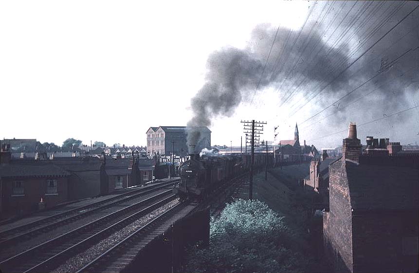 View of ex-MR 0-6-0 4F No 43926 at the head of a down goods train approaching Camp Hill Signal Box