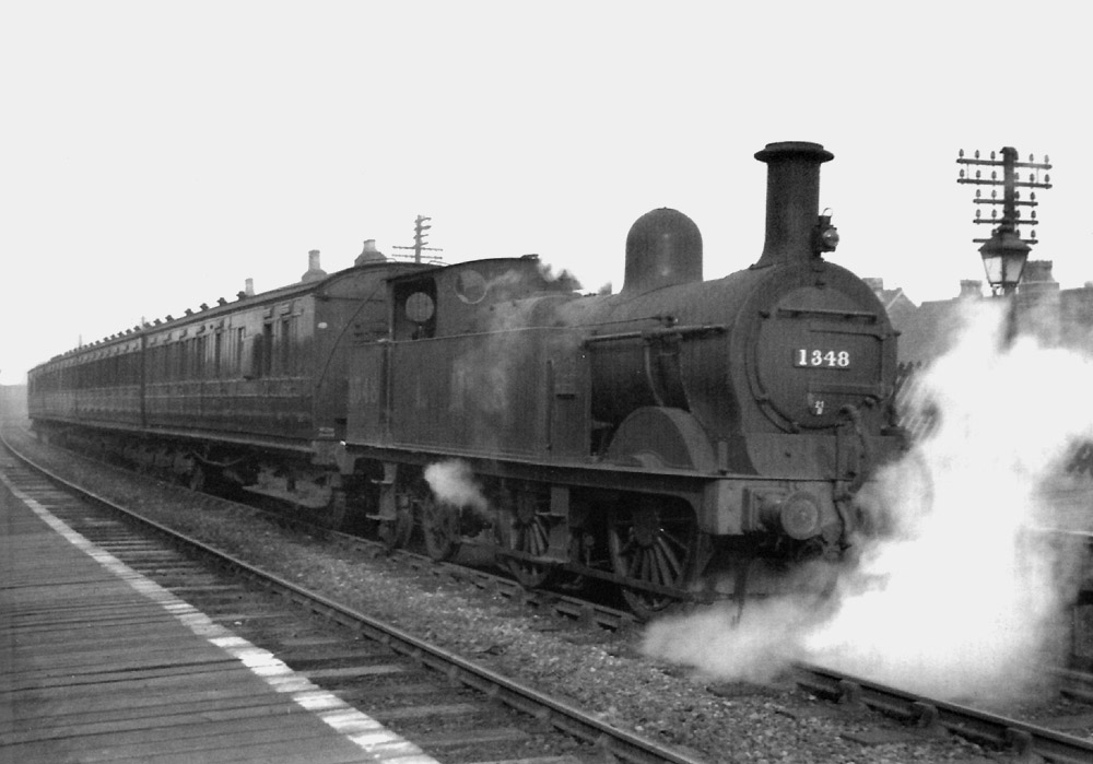 Ex-MR 0-4-4T 1P No 1348 is seen at the head of a suburban service during the afternoon on 2nd March 1936