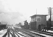 Ex-MR 0-6-0 3F No 43464 is seen passing Camp Hill signal box on a Class H through freight train in 1953
