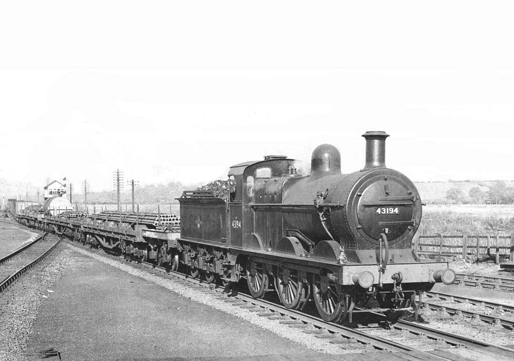 Ex-S&D 3F 0-6-0 No 43194 is seen at the head of a freight en-route to Kings Norton during May 1957