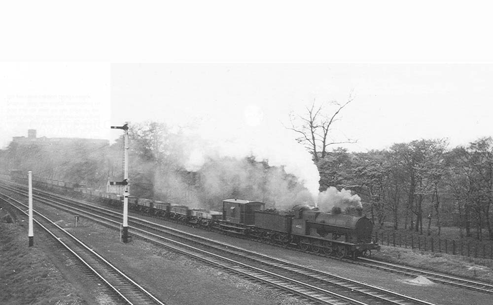 Ex-LNWR 'Super D' 0-8-0 No 49212 nears Castle Bromwich with a freight train on the down goods line