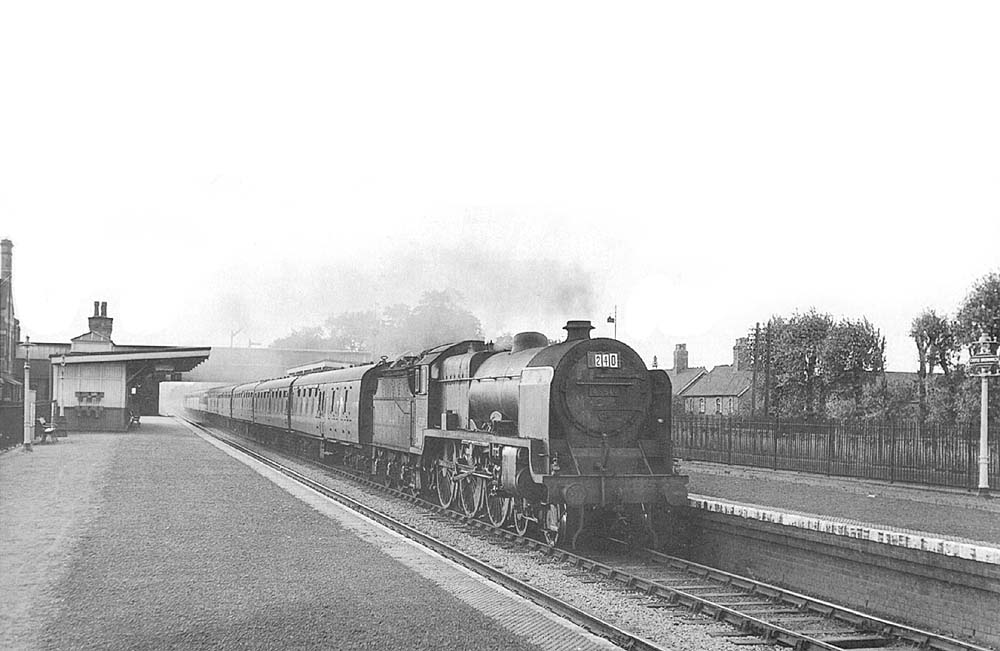 Ex-LMS 5XP 4-6-0 No 45519 'Lady Godiva. a Patriot class locomotive, runs through the station on the up Devonian on Saturday 5th September 1959