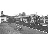 BR Derby Lightweight two-car Diesel Multiple Units stand on the down platform during May 1955