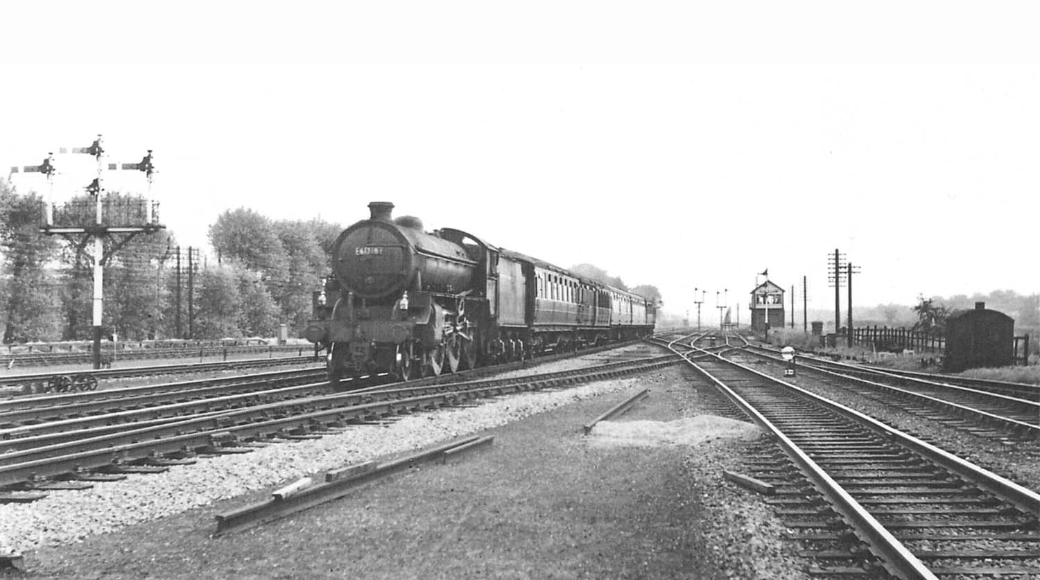 British Railways B1 4-6-0 No 61318 passes Castle Bromwich signal box with the daily Cleethorpes to New Street service on 7th July 1962