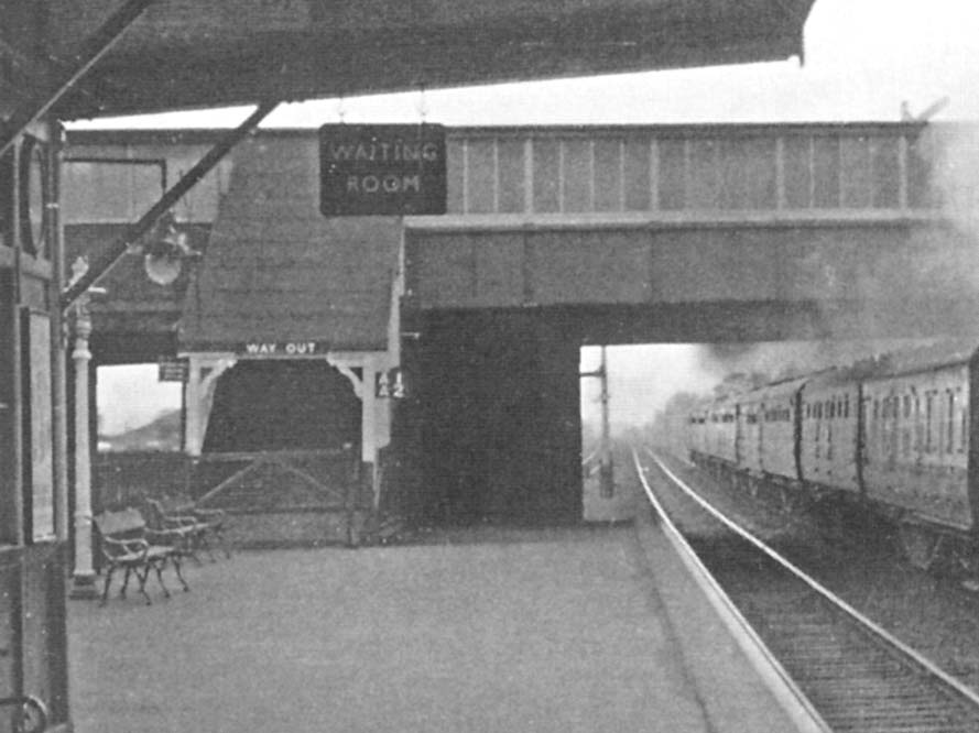 Close up showing the stairs to the passenger footbridge which led to the booking office and the other platform