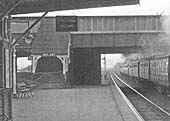 Close up showing the stairs to the passenger footbridge which led to the booking office and the other platform