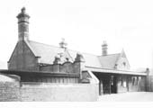 Castle Bromwich station's road bridge entrance  with a long canopy carried between its two wing walls