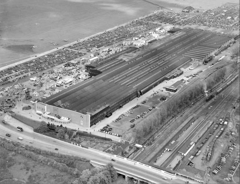 First of seven aerial photographs showing the British Industries Fair exhibition hall and Castle Bromwich station and goods yard