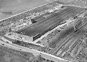 First of seven aerial photographs showing the British Industries Fair exhibition hall and Castle Bromwich station and goods yard