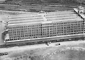 Third of five aerial photographs showing the Fort Dunlop factory and sidings together with the adjacent railway