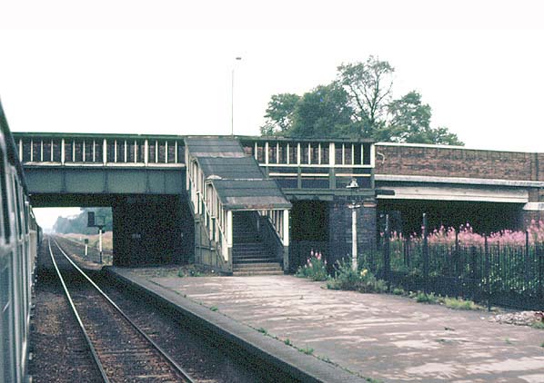 The steps from the footbridge leading down from the covered footbridge on to the western end of the up platform on 28th July 1973