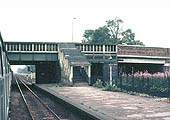 The steps from the footbridge leading down from the covered footbridge on to the western end of the up platform on 28th July 1973