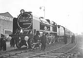 LMS 6P 4-6-0 No 6100 'The Royal Scot' stands at the British Industrial Fair adjacent to the station