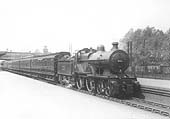 Ex-MR 2P 4-4-0 No 531 passes through the station on an up express service on 3rd June 1925
