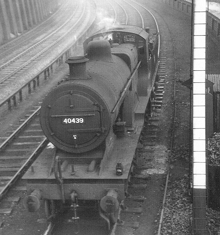Ex-MR 4-4-0 2P No 40439 is held by Church Road down starting signal from the goods branch on 19th December 1954