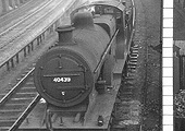 Ex-MR 4-4-0 2P No 40439 is held by Church Road down starting signal from the goods branch in December 1954