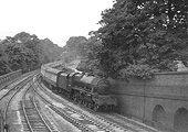 Ex-LMS 4-6-0 5XP No 45690 'Leander' is working an up express service to New Street station circa 1953