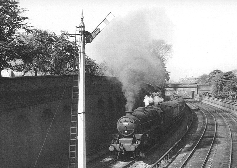 Ex-LMS 4-6-0 5MT No 45250 is working hard at the head of a down express passenger service on 31st July 1955