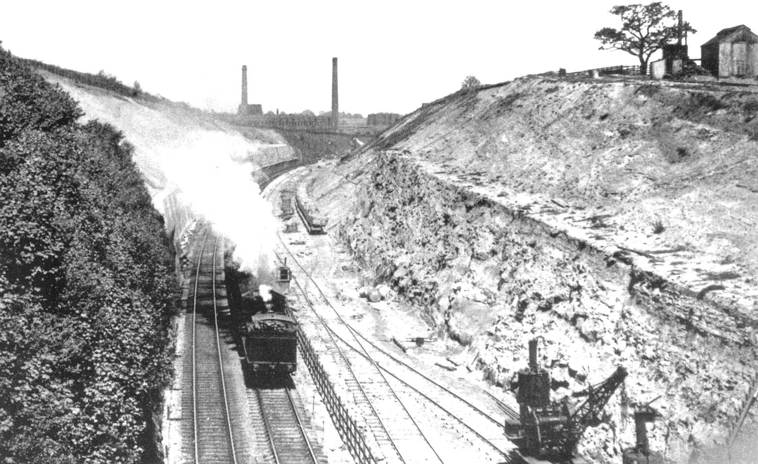An unidentified ex-MR 0-6-0T is seen running bunker first through Cofton Cutting in the summer of 1929