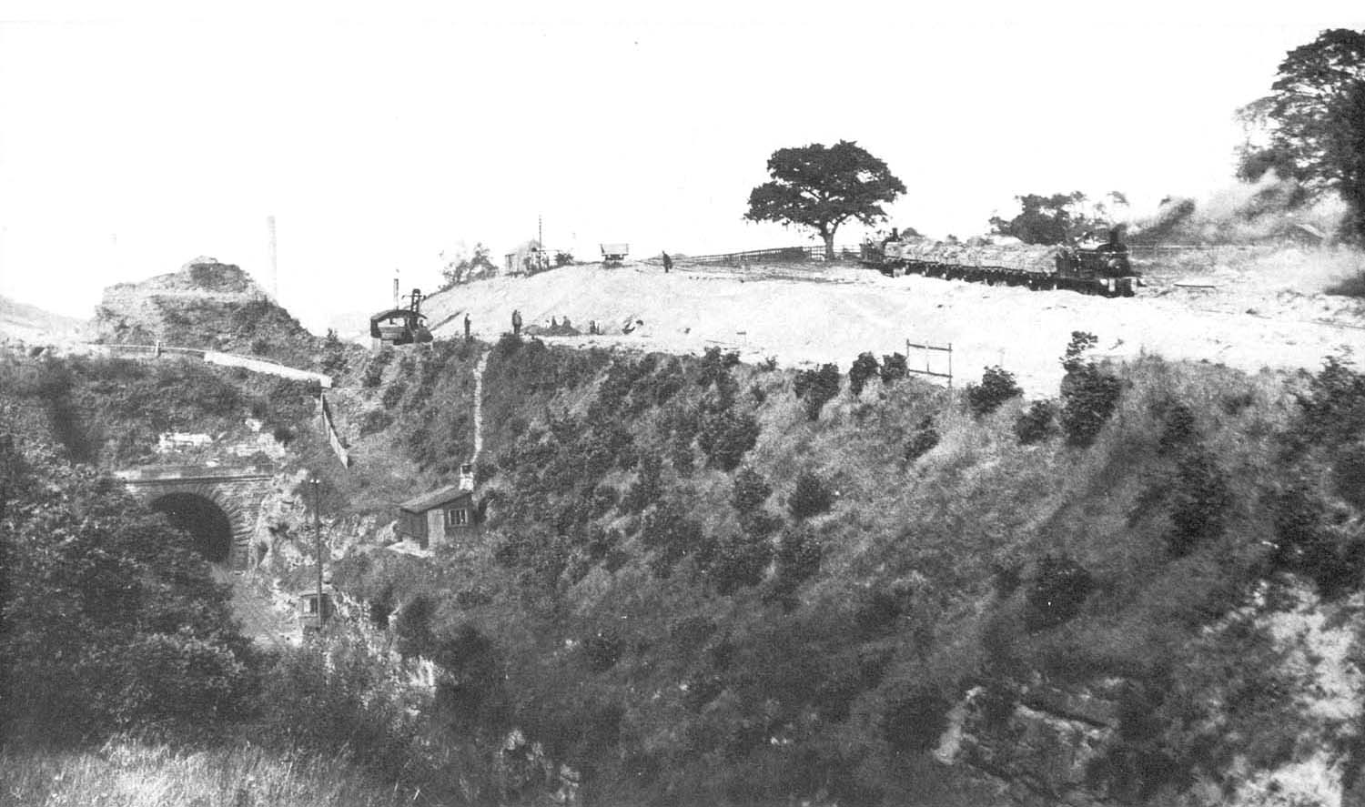 The entrance to Cofton tunnel can be seen beneath the early stages of the cutting being widening in the summer of 1928