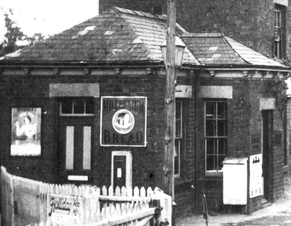 Close up of the booking office and waiting room complete with a post box in the gable wall