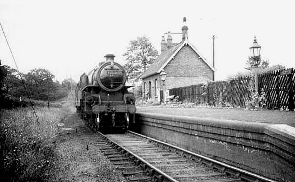 Ex-LMS 4MT 2-6-0 Mogul No 43013 stands at the head of an Ashchurch to Birmingham train 