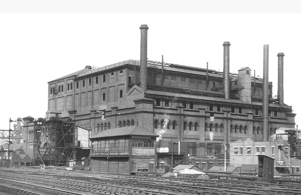 View of Duddeston Road Junction signal box being dwarfed by Saltley Gas Works as seen on Sunday 25th April 1954