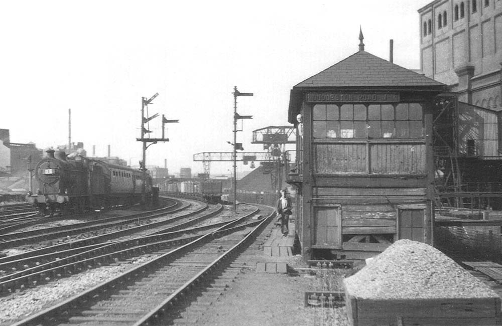An unidentified ex-LMS 3F 0-6-0 'Large Goods' locomotive passes the second Duddeston Road Junction signal box on 5th July 1953