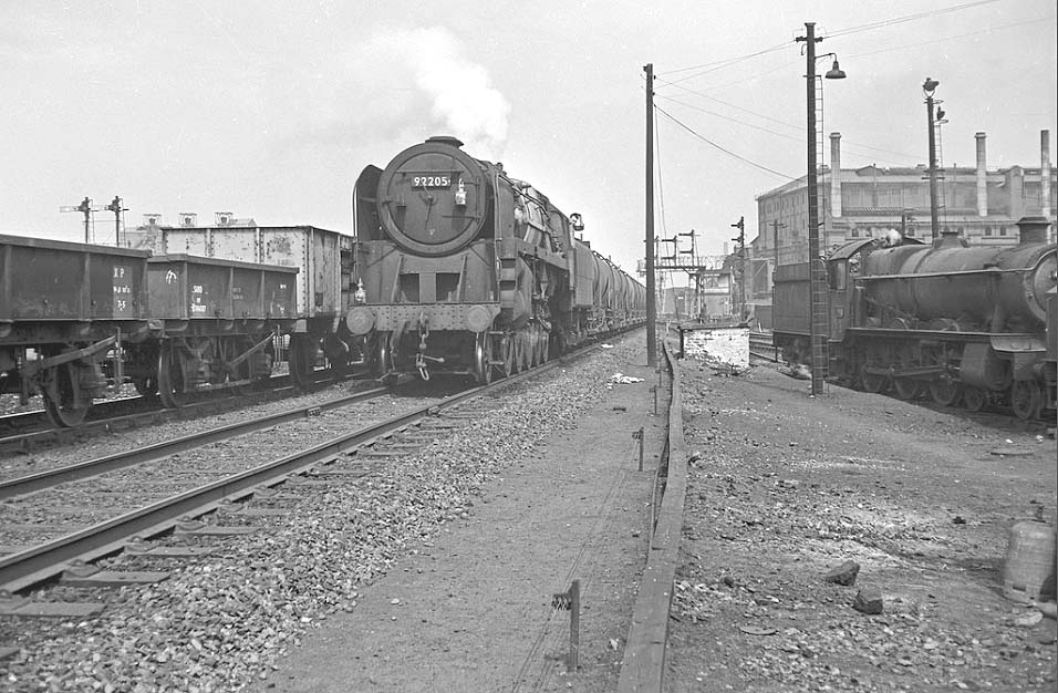 BR Standard 9F 2-10-0 No 92150 passes Saltley shed on an oil train from Bomford Bridge to Fawley in Hampshire