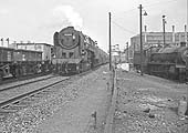 BR Standard 9F 2-10-0 No 92150 passes Saltley shed on an oil train from Bomford Bridge to Fawley in Hampshire