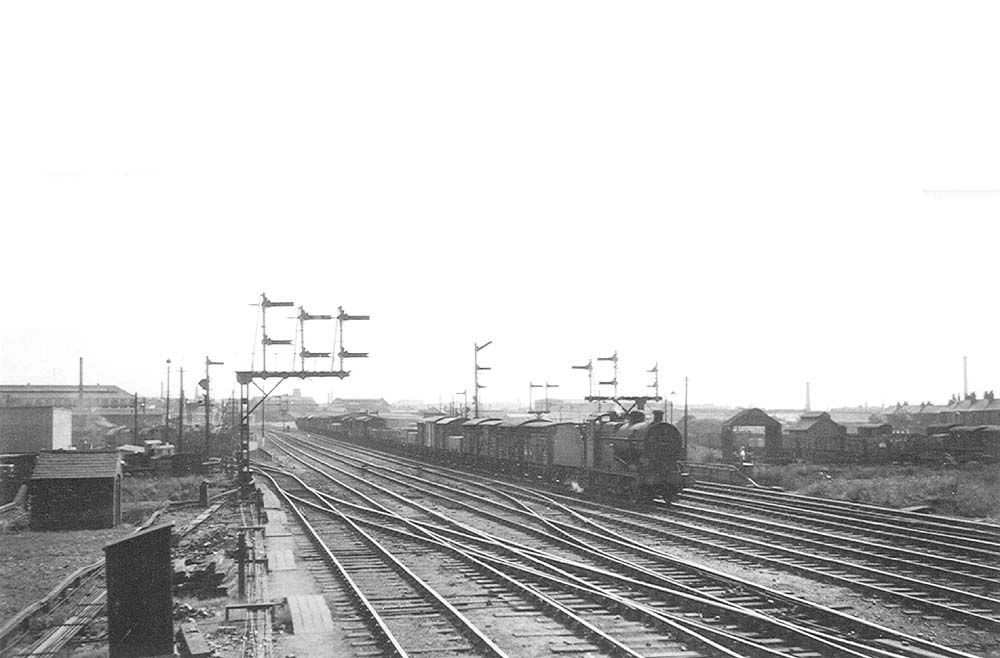 An unidentified ex-LMS 4F 0-6-0 goods locomotive is seen approaching Duddeston Road Junction signal box