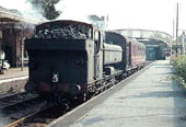 An unidentified ex-GWR 0-6-0PT stands at Evesham with a single coach on a down service from New Street to Ashchurch in October 1962