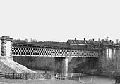 A view of the viaduct which carried the Aschurch to Evesham line over the River Avon with the GWR shed in background