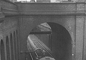 View of ex-LMS 0-6-0 3F No 43675 taking water as it runs tender first to New Street station on 24th May 1953
