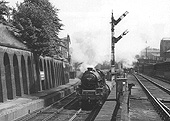 Ex-LMS 4-6-0 5XP No 45572 'Eire' passes through the former Five Ways station at the head of a down express