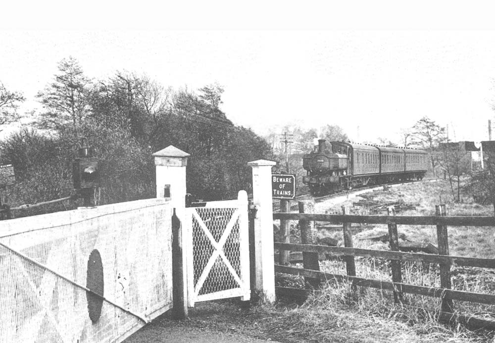 British Railways 0-6-0PT 64xx class pannier No 7448 approaches Frogmill Crossing with an empty Workman's train returning from Longbridge on Friday 4th April 1958